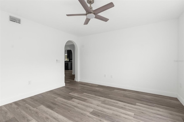 unfurnished room with ceiling fan and wood-type flooring