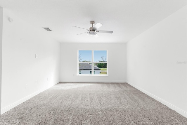 unfurnished room featuring carpet flooring and ceiling fan