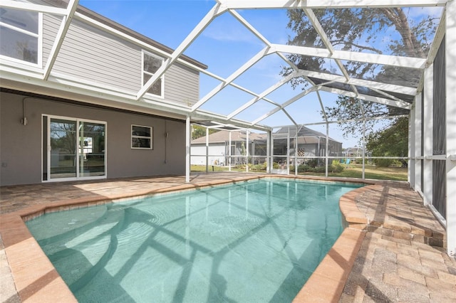 view of pool featuring a lanai and a patio area