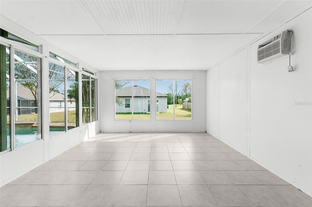 unfurnished sunroom with an AC wall unit