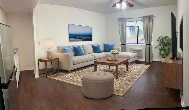 living room featuring ceiling fan and dark hardwood / wood-style flooring