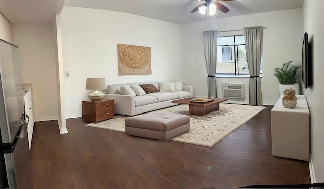 living room featuring ceiling fan and dark hardwood / wood-style flooring