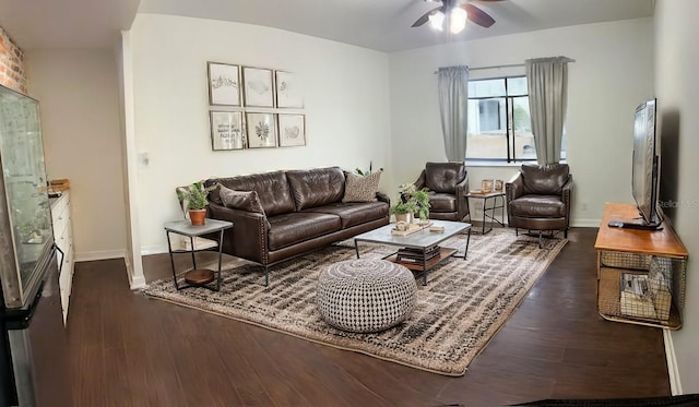 living room with ceiling fan and dark hardwood / wood-style floors