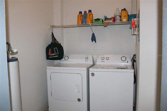 washroom featuring separate washer and dryer and water heater