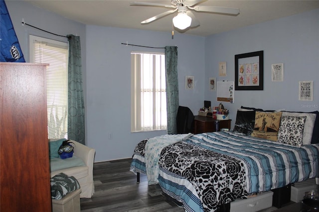 bedroom with ceiling fan and dark wood-type flooring