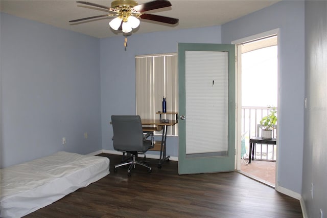 bedroom featuring ceiling fan and dark wood-type flooring