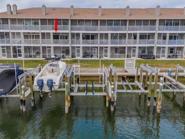 view of dock featuring a water view and boat lift