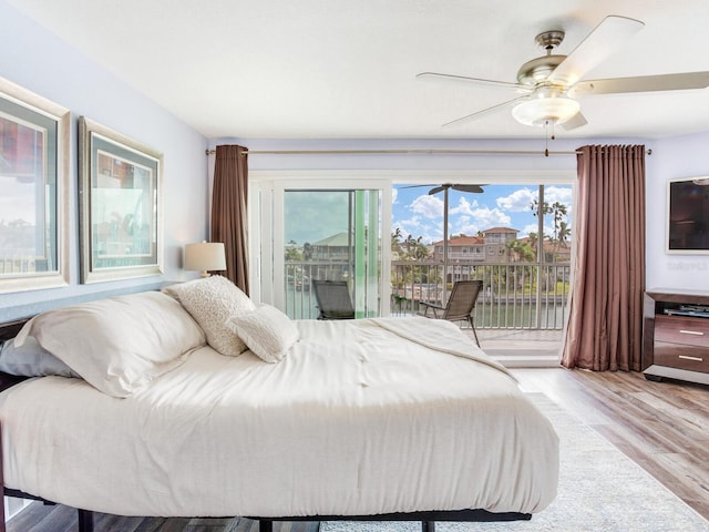 bedroom featuring access to exterior, ceiling fan, and light hardwood / wood-style floors