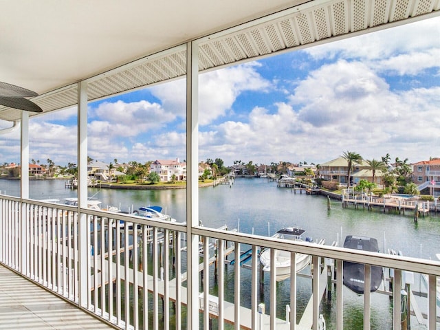 unfurnished sunroom featuring a water view