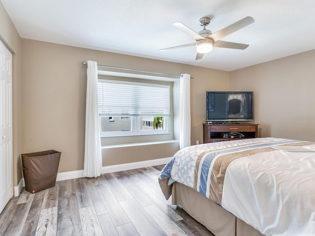 bedroom featuring a closet, ceiling fan, and hardwood / wood-style floors