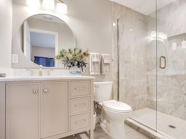 bathroom featuring toilet, vanity, and walk in shower