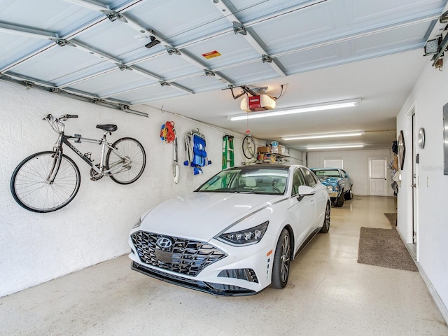 garage featuring a garage door opener