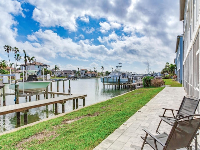 view of dock featuring a yard and a water view