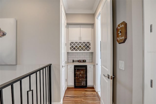 hall featuring light hardwood / wood-style flooring and wine cooler