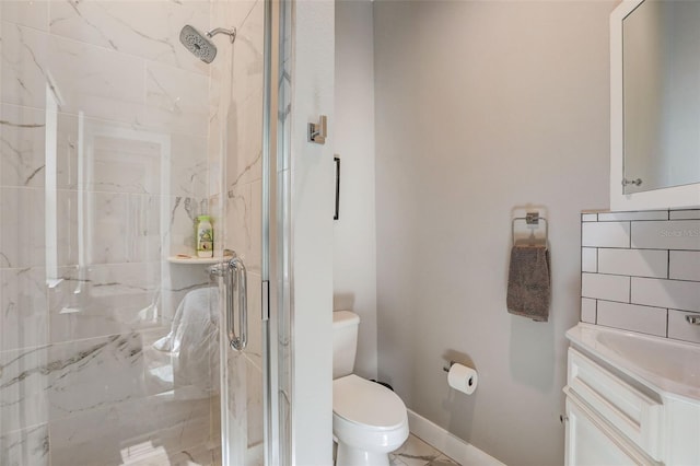 bathroom with tasteful backsplash, tile patterned floors, toilet, a shower with door, and vanity