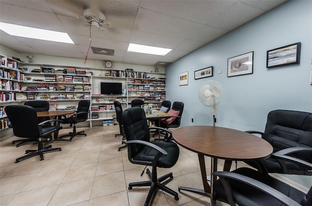 tiled office featuring ceiling fan and a drop ceiling