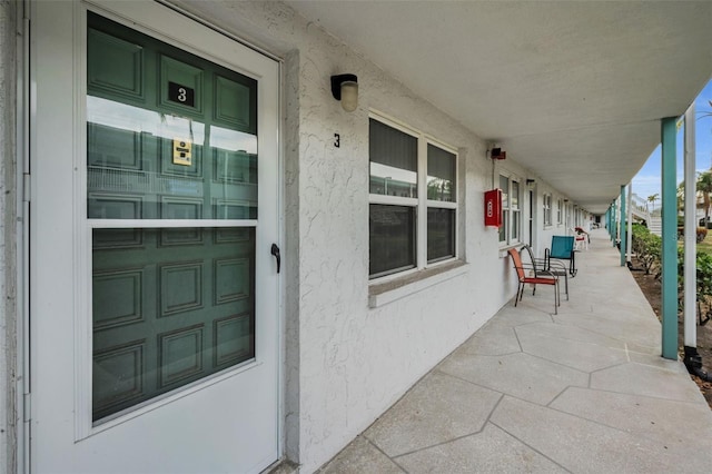 doorway to property featuring covered porch