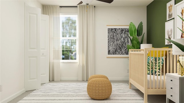 bedroom with ceiling fan and light colored carpet