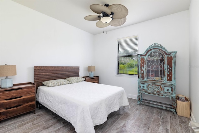 bedroom featuring hardwood / wood-style flooring and ceiling fan