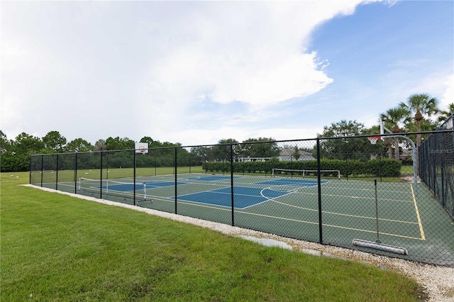 view of basketball court featuring a yard and tennis court