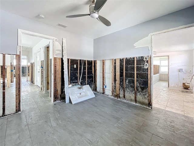 interior space featuring ceiling fan