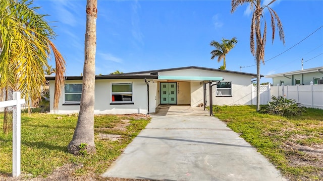 view of front of home with french doors and a front yard