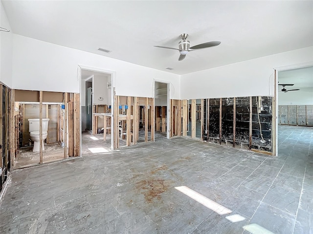 interior space with ceiling fan