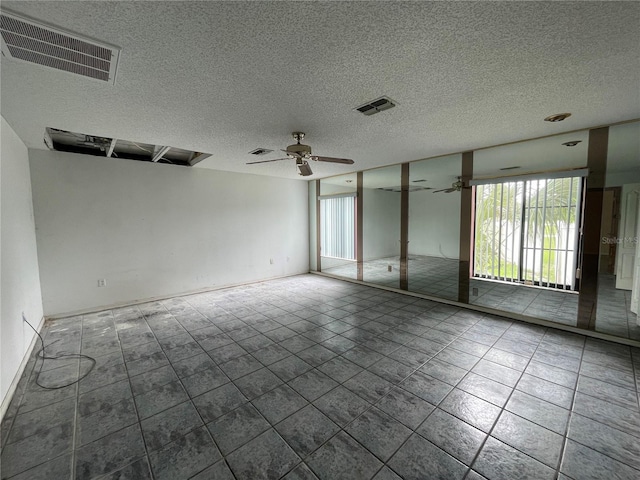 spare room with ceiling fan