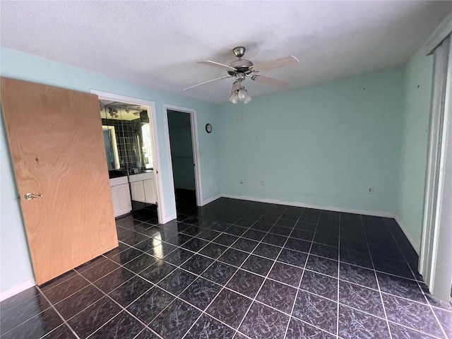 spare room featuring ceiling fan