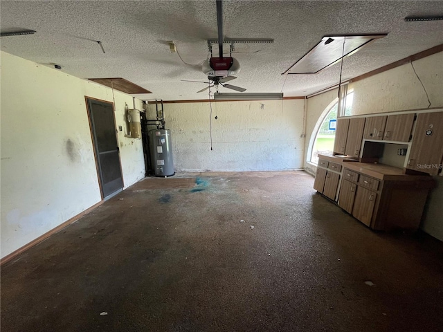 garage featuring electric water heater and a garage door opener