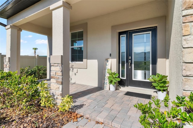 entrance to property featuring a porch