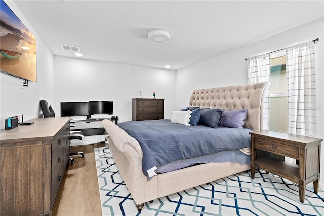 bedroom featuring light hardwood / wood-style flooring