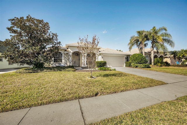 view of front of property featuring a garage and a front lawn