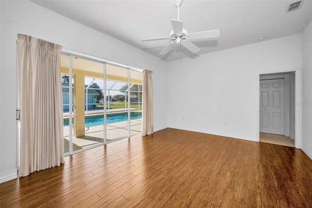 unfurnished room with hardwood / wood-style flooring and ceiling fan