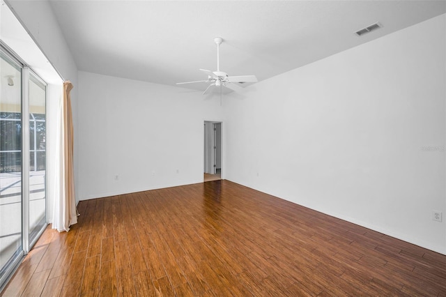 empty room with hardwood / wood-style floors and ceiling fan