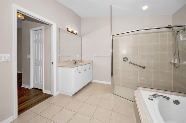 bathroom with tile patterned flooring, vanity, and separate shower and tub