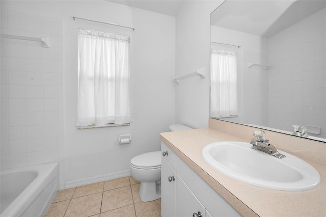 bathroom featuring tile patterned flooring, vanity, toilet, and a wealth of natural light