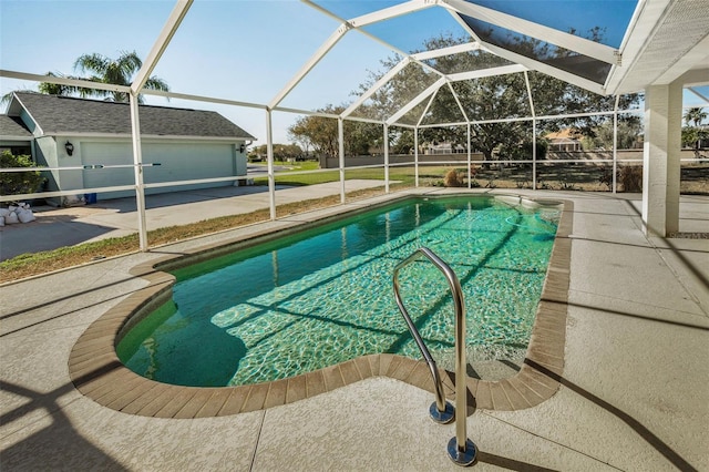 view of pool with an outbuilding and glass enclosure