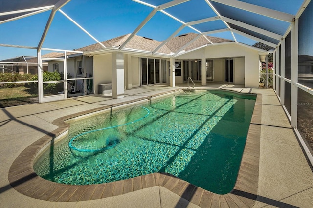 view of pool featuring a lanai and a patio area