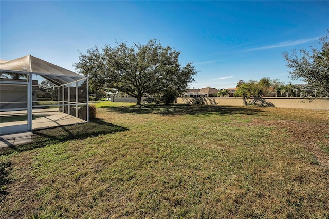 view of yard with a lanai