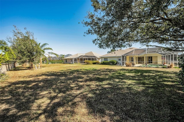 view of yard featuring a lanai