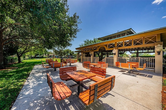 surrounding community with a gazebo and a lawn