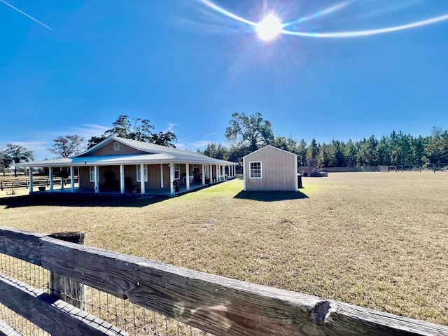 exterior space with an outbuilding and a rural view