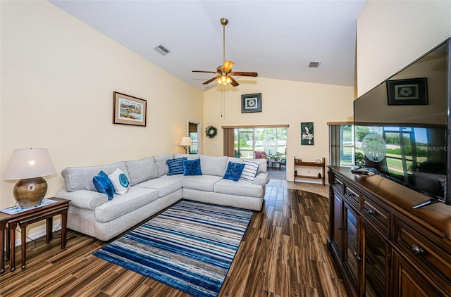 living room with dark hardwood / wood-style floors, high vaulted ceiling, and ceiling fan