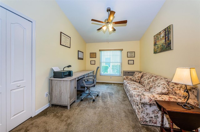 carpeted office space with ceiling fan and lofted ceiling