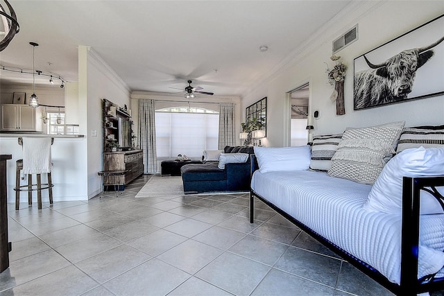 tiled living room featuring crown molding, ceiling fan, and a healthy amount of sunlight