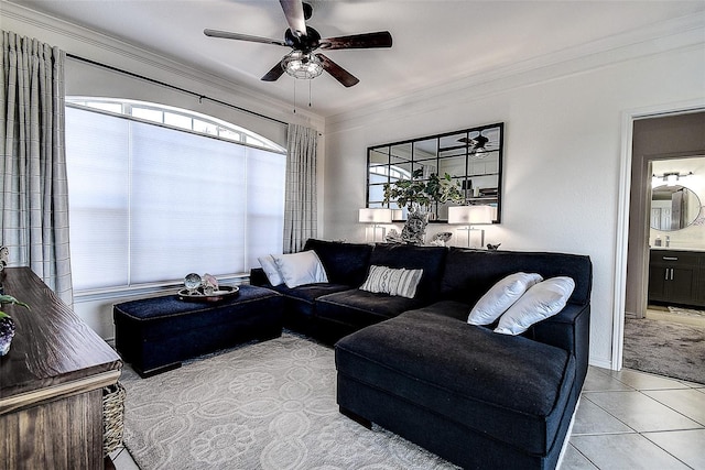 tiled living room with crown molding and ceiling fan