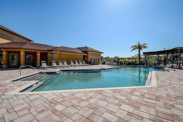 view of pool with a patio area and a pergola