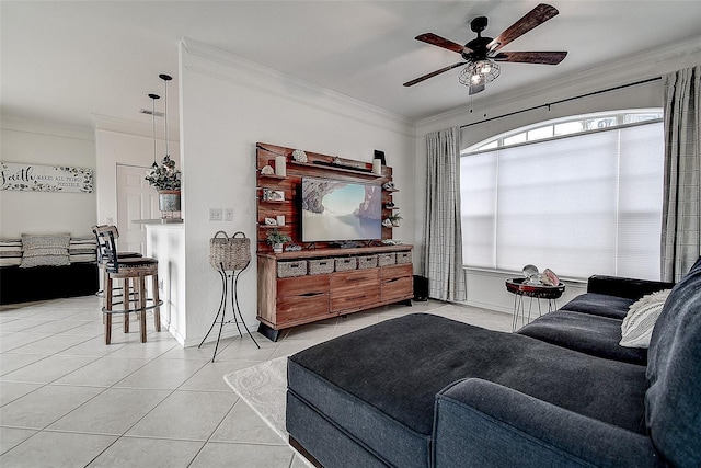 tiled living room featuring crown molding and ceiling fan