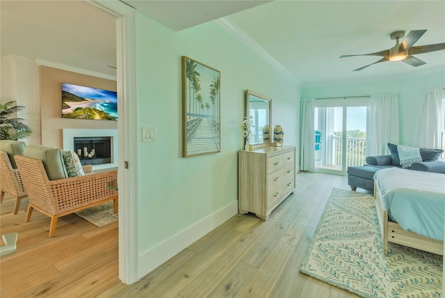 bedroom featuring access to outside, ceiling fan, light hardwood / wood-style flooring, and crown molding